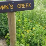 Brown's Creek Sign with Flowers